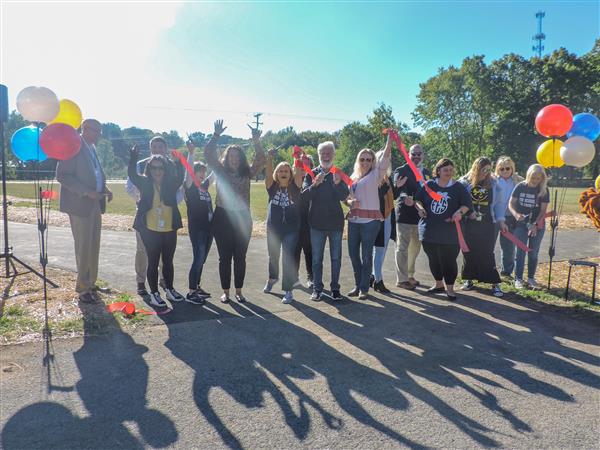 A ribbon being cut for a new track at FES.